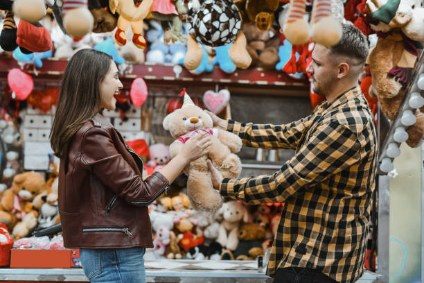 istock Female Being Surprised With Stuffed Bear Reacting With Awe and Open Mouth 2199095736