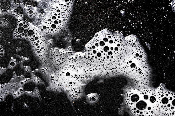 istock Foam texture. White bubbles on a black background. Washing a frying pan. 2199101023