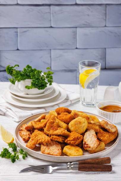 istock fried chunks, bites, tenders, nuggets on a plate 2199103637