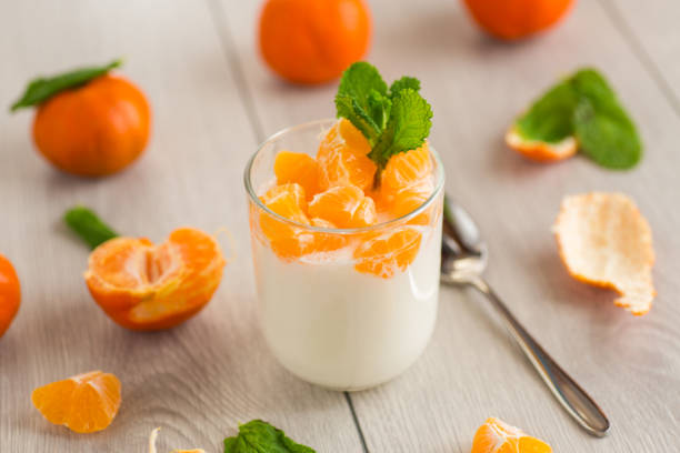 Milk dessert with tangerine pieces.