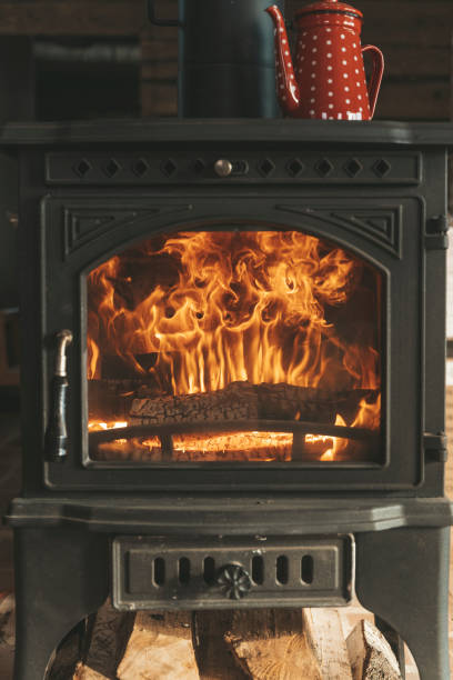 istock Fire with wood in the stove. Home cozy 2199107941