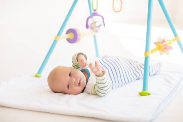 istock Little baby on white bed 2199110878