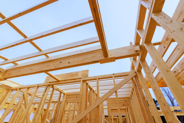 istock Construction of a wooden frame building under a clear sky during daylight hours 2199111442
