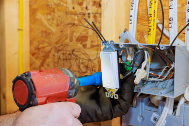 istock Electrician installing a switch in a residential building during renovation work 2199111477