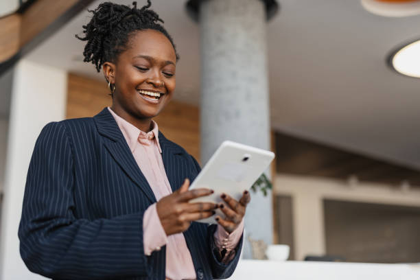 istock Woman engaging with tablet, vibrant office scene 2199112187
