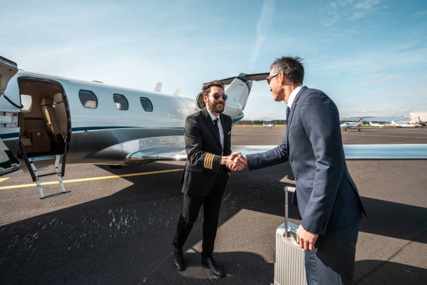 Pilot Handshake with Asian Business Executive at Private Jet