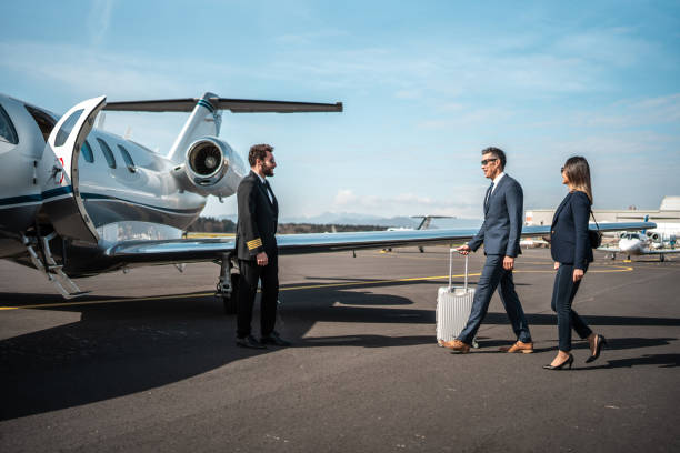 istock Asian Executives Shaking Hands with Pilot by Private Jet 2199112388