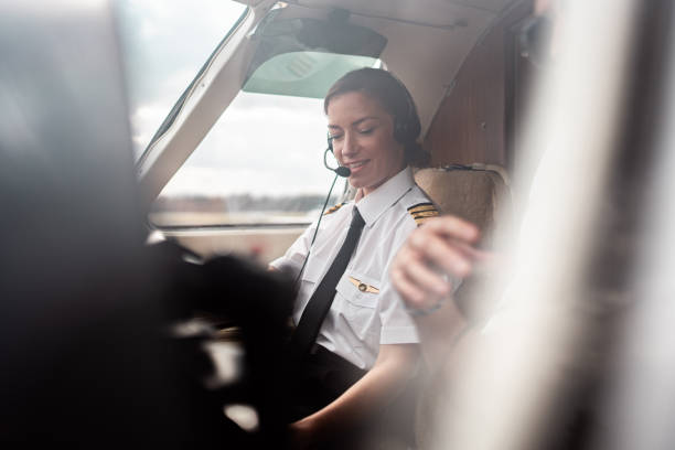 istock Professional Female Pilot in Aircraft Cockpit 2199112509