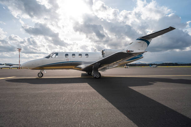 istock Sleek Private Jet Ready for Takeoff on Sunny Airfield 2199112525
