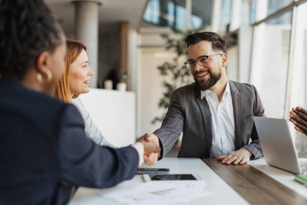 istock Business Team Meeting and Handshake at Table 2199112733