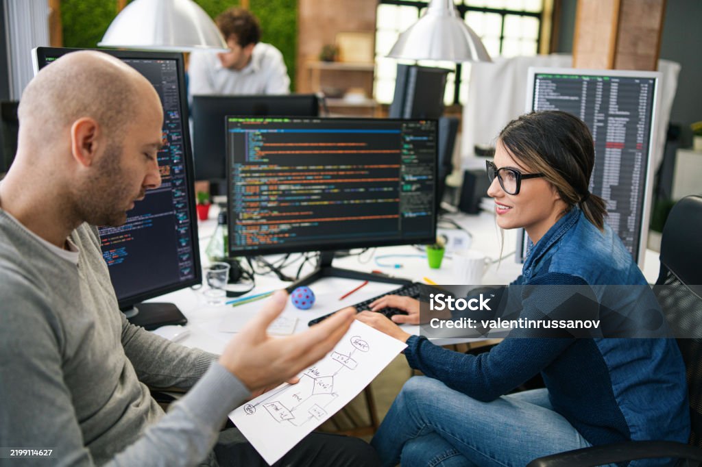 Software Programmers Analyzing Html Code And Database Brainstorming ...