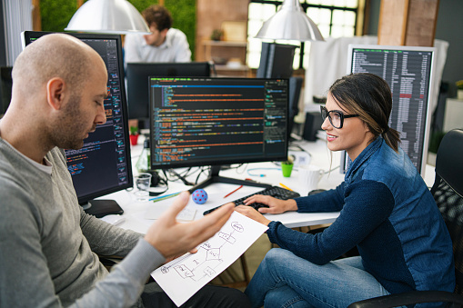 Software Programmers Analyzing Html Code And Database Brainstorming ...