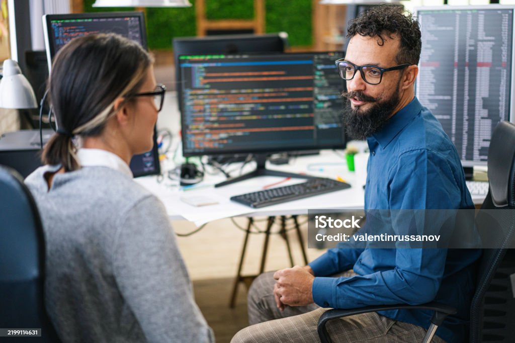Software Programmers Analyzing Html Code And Database Brainstorming ...