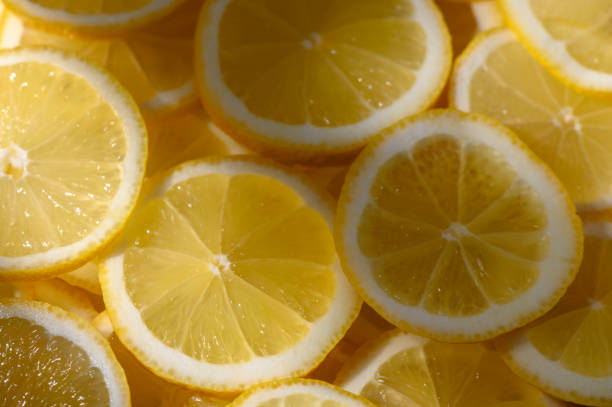 istock Sliced lemons arranged in vibrant patterns create a refreshing burst of color for summer recipes 2199115990