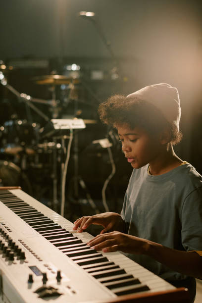 istock Teen Boy Playing Keyboard at Studio 2199116080