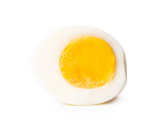istock Side view of single cooked or boiled egg with egg yolk in half isolated on white background with clipping path 2199116101