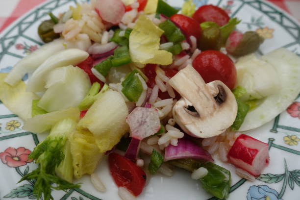 istock Rice salad with mixed raw vegetables  Meal served 2199117760