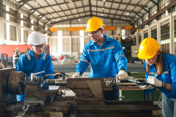 istock Team work of technicians together with factory mechanical engineers are inspecting machinery on the production line to plan annual maintenance. 2199120590
