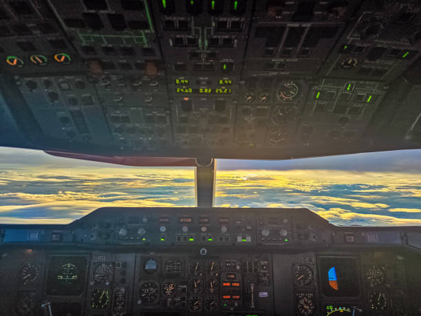istock Cockpit view overlooking clouds at sunset, an aviation dream in progress 2199120749