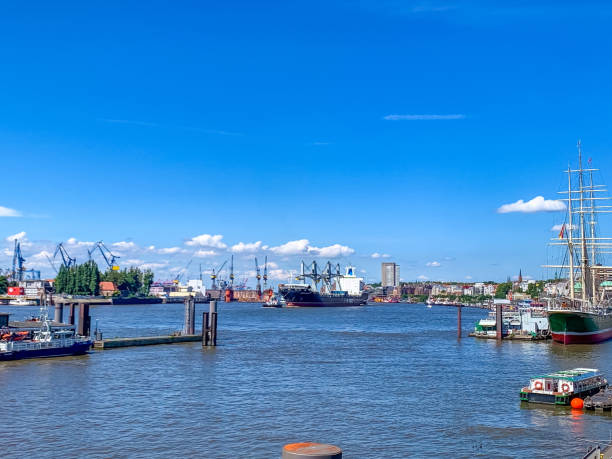 istock Hamburg harbor panorama with cargo ships, cranes, and historic sailing vessel 2199120909