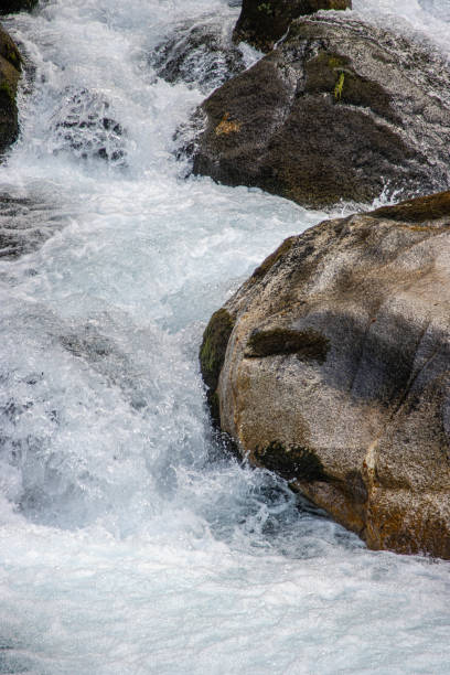 Majestic River Flow, Crystal Waters Crashing Against a Giant Rock