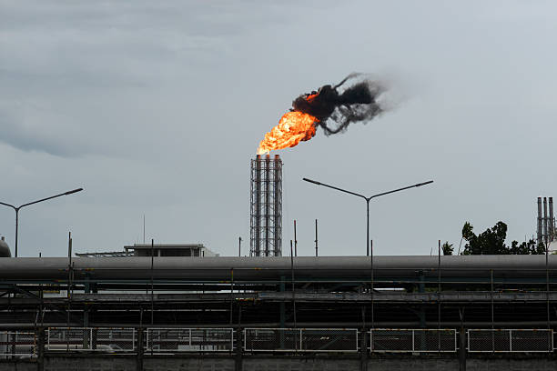 The gas separation station is releasing fire through the pipe.
