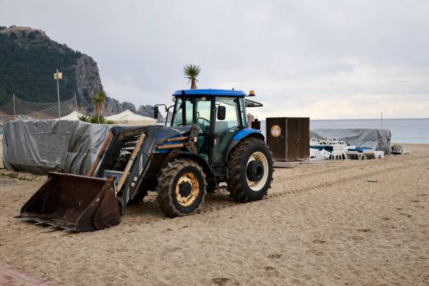 istock tractor on the sea beach 2199126361