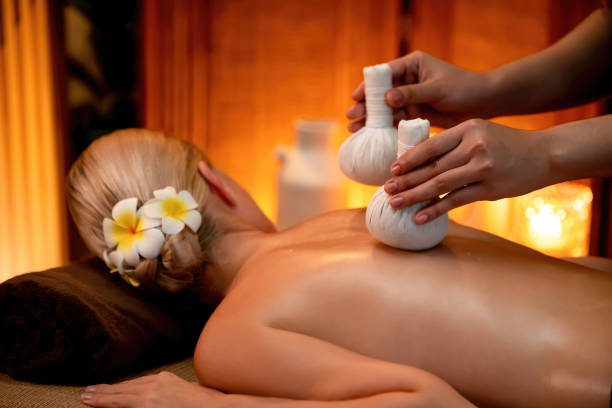 istock Hot herbal ball spa massage body treatment. Quiescent 2199126477