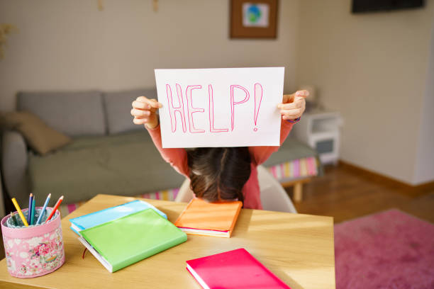 istock HELP sign in girl's hand 2199127128