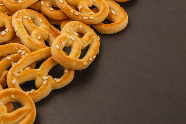 istock Deliciously baked pretzels scattered on a dark surface in a cozy kitchen 2199129198