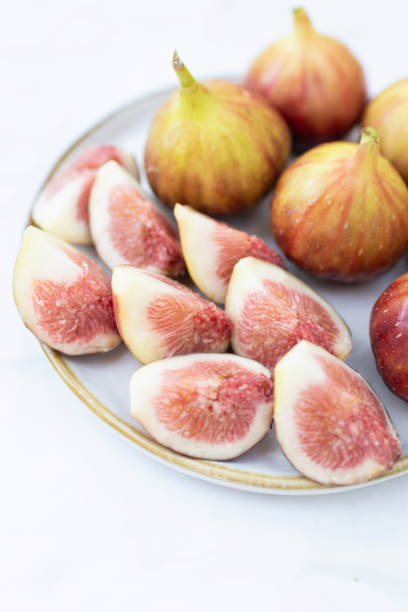 istock Fresh figs on a white plate ready to enjoy. 2199129329