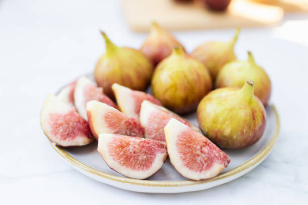 istock Fresh figs on a white plate ready to enjoy. 2199129378