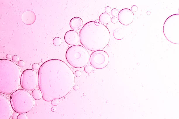 istock Bubbles macro pink,oil with bubbles on coral background. Pink Abstract space background. Soft selective focus. macro of oil drops on water surface. copy space. air bubbles in water, Banner format 2199129384