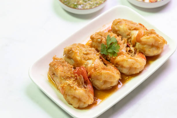 istock Garlic shrimp stir-fry on white plate; easy and delicious menu. 2199130469