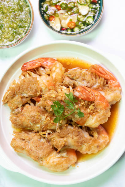 istock Garlic shrimp stir-fry on white plate; easy and delicious menu. 2199130476