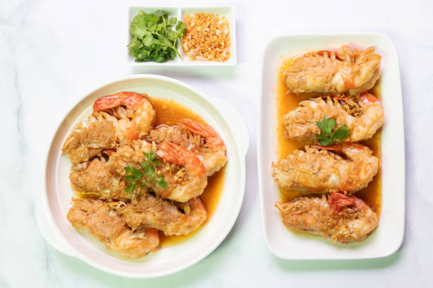 istock Garlic shrimp stir-fry on white plate; easy and delicious menu. 2199130478