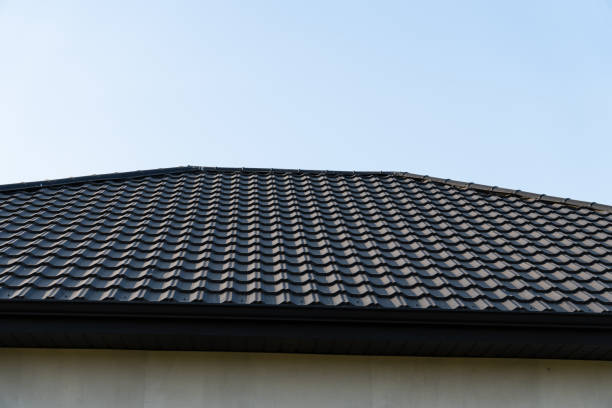 istock A black tile roof showcases its neat pattern under a clear blue sky, emphasizing craftsmanship and modern architectural design 2199132667