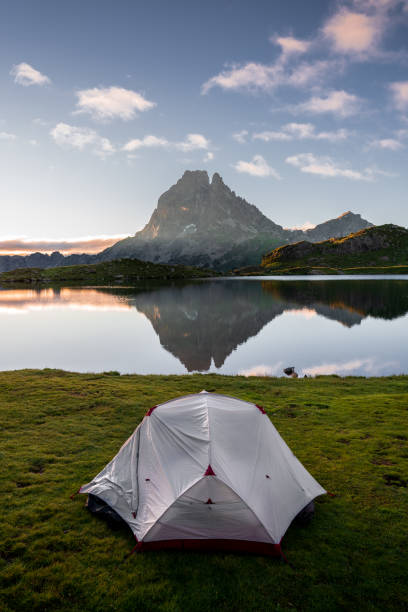 istock White tent in front of Lac D’Ayous at sunrise 2199132888