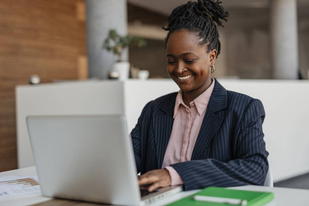 istock Focused Businesswoman Reviewing Documents at Desk 2199132989