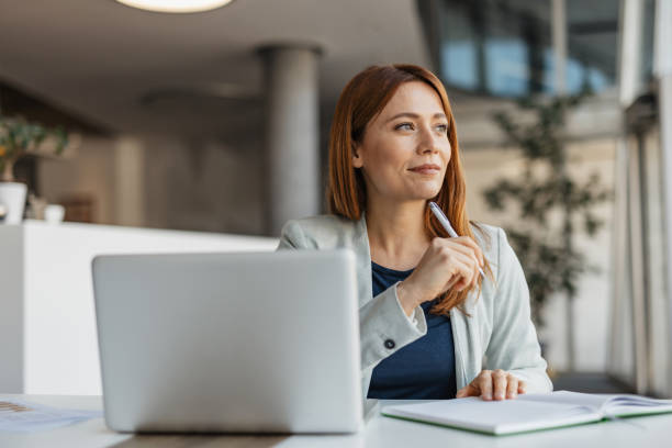 istock Pensive Businesswoman in a Modern Office 2199133338