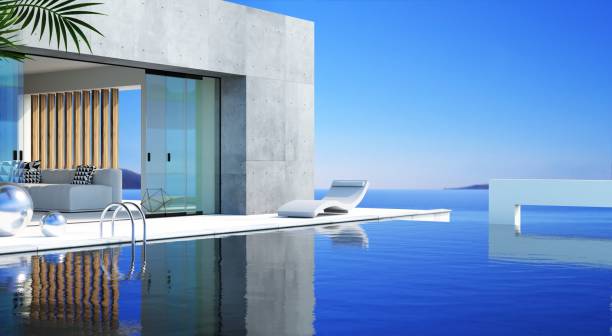istock Sea Concrete modern villa with pool and sunbeds 2199133600