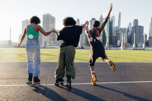 istock Friends on quad roller skates enjoying dancing together 2199133852