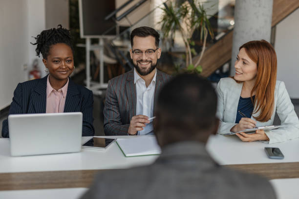istock Business Team with Smiles During Discussion 2199134611