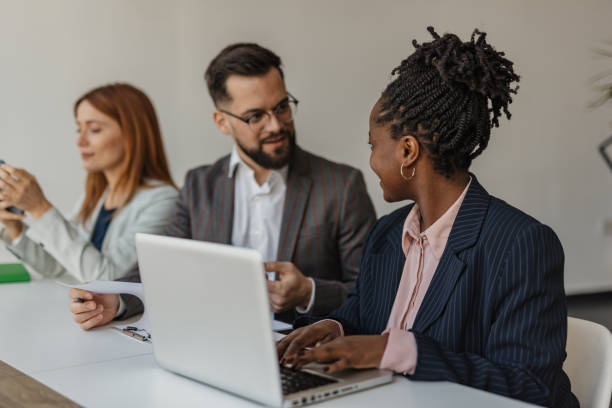istock Professional Collaboration with Laptops and Paper 2199135137
