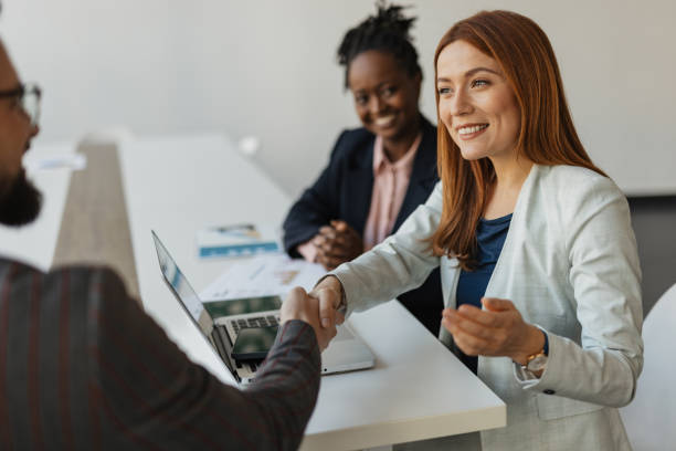 istock Business Meeting with Handshake at Collaboration Desk 2199135525