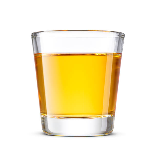 istock Small shot or yellow hard liquor beverage isolated on white. 2199135577