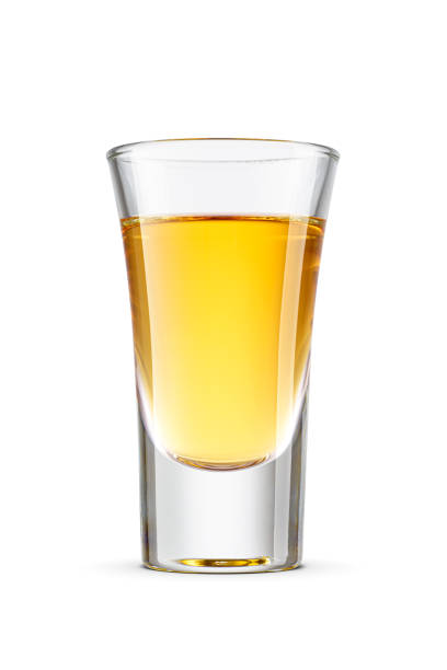 istock Golden tequila shot or yellow alcoholic drink isolated on white. 2199135579