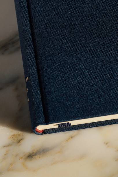 istock hardcover book in blue book cloth on marble 2199135848