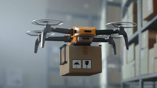 istock Modern Warehouse Facility: Aerial AGV Drone Delivering Cardboard Box 2199136995