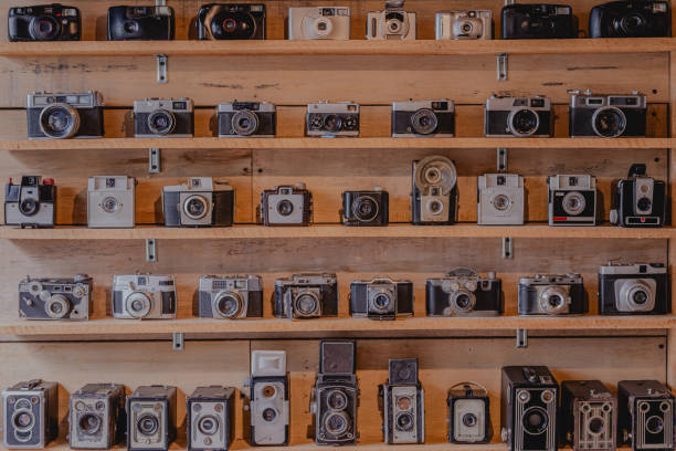istock vintage camera collection displayed on a five row wooden shelf 2199137615